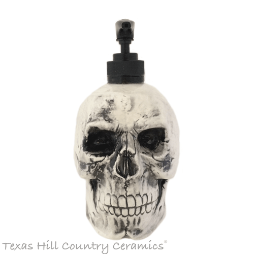 Antique black skull dispenser for bath or kitchen.