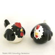 Fat rooster and chicken salt and pepper shakers.