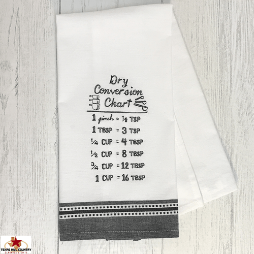 Conversion chart embroidered cotton dish towel in black and white.