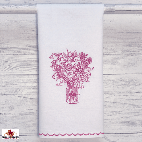 Mason wildflower embroidery design in fuchsia on white cotton towel.