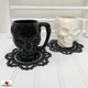Doily used as a coaster for skull mugs.  Mugs sold separately.
