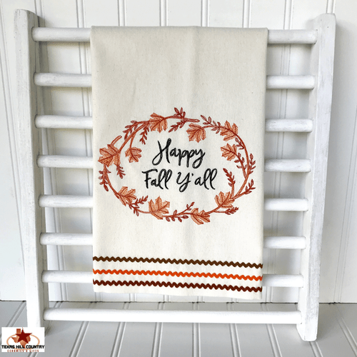 Happy Fall Y'all greeting embroidered on a natural cotton dish towel.