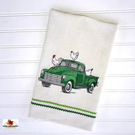 Green pick-up truck with chickens embroidered on natural cotton towel.