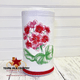 Disenfecting wipes holder cover with embroidered red geranium flower.
