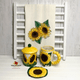 Several ceramic sunflower items coordinate perfectly with the embroidered sunflower towel.