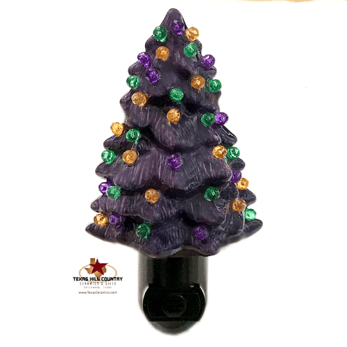Purple tree with Halloween color lights in green, orange, purple and yellow.