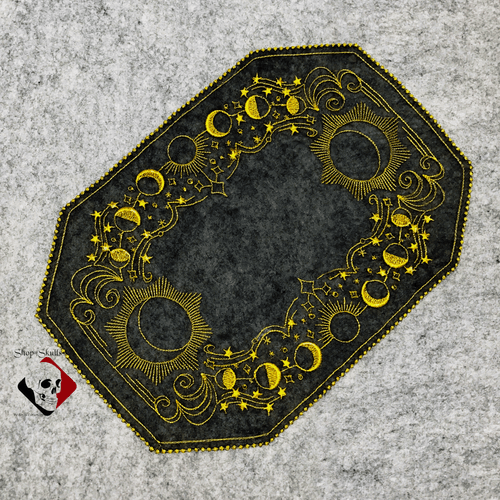 Organza doily with celestial bodies embroidery.