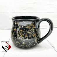 Large kettle cauldron mug in cosmic burst glaze holds 20 ounces comfortably.