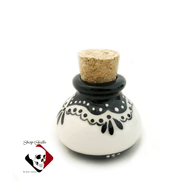 Small round fancy apothecary jar with cork stopper, holds 2 ounces.
