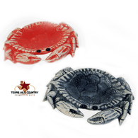 Crab tea bag holder in marine blue or coral red.