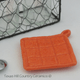 Orange hot pad tea bag holder