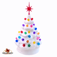 Little white ceramic Christmas tree with gum drop color light and snowflake star.