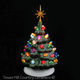 This small Green ceramic Christmas tree with color lights and star is ideal for confined areas