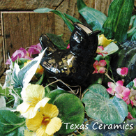 Black bird ceramic plant tender.