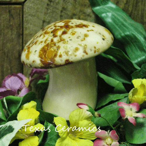 Mushroom or toad stool ceramic plant tender.