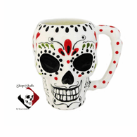 Skull mug with Day of the Dead Mexican folk art design.