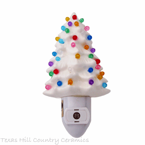 White ceramic Christmas tree night light with color globe lights for the home or office.