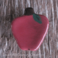 Apple shaped magnetic needle minder for cross stitch, hand stitching or embroidery needle work, made in the USA.