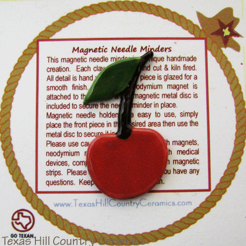 Red cherry on a stem magnetic needle minder made in the USA.