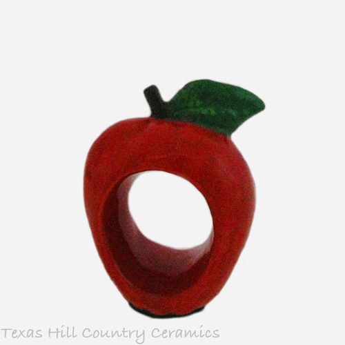 Ruby red ceramic apple napkin ring.