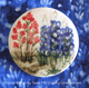 Hand made round style refrigerator magnet with Texas Bluebonnets made in the USA
