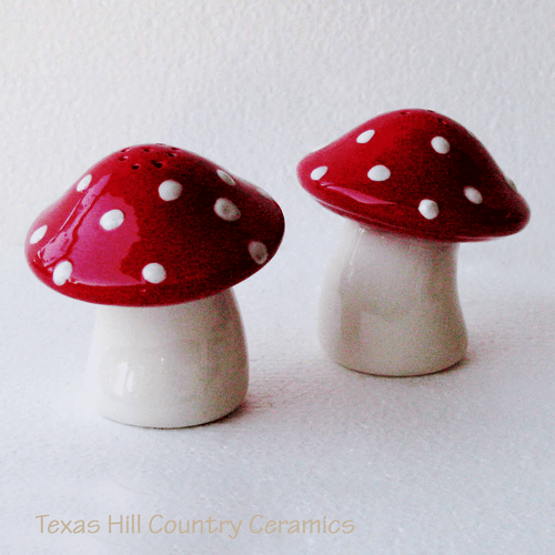 Mushroom salt and pepper shakers with red cap white dots.