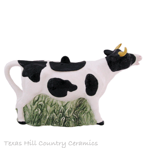 Black and white cow teapot made in the USA.