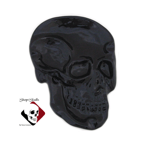 Skull shaped spoon rest in black, made in the USA.