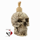 Aged skull with cobweb design with tan pump unit.