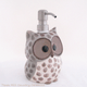 Owl soap dispenser in natural shades of color with stainless pump.