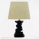 This black skull and bones lamp base is fitted with a rectangle lamp shade that measures 7 inches x 9 inches x 7 inches, shade is not included with lamp base.