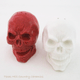 Alternative decor red and white skull salt and pepper shakers.