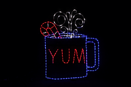 Animated red, blue and white LED light display of a cup of cocoa with candy cane garnish in a cup with "YUM" written on it