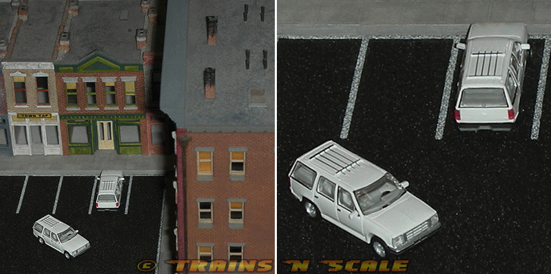 Pair of Atlas 60 000 053 Unlettered White 1993 Ford Explorer SUVs in an N-Scale Diorama